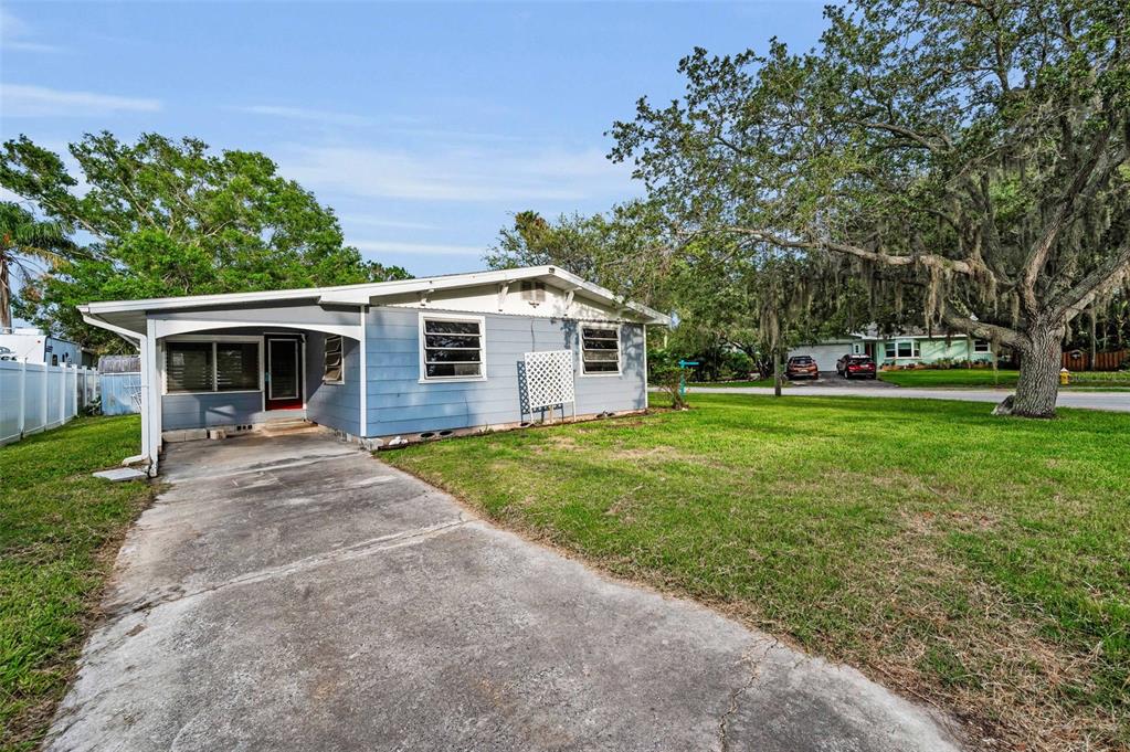 394 Georgia Avenue Crystal Beach, FL 34683 - Photo 18 of 69 a front view of house with yard and green space