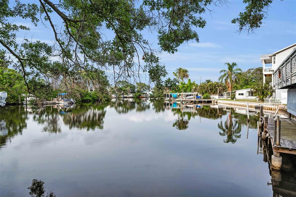 394 Georgia Avenue Crystal Beach, FL 34683 - Photo 20 of 69 a lake view with boat and palm trees