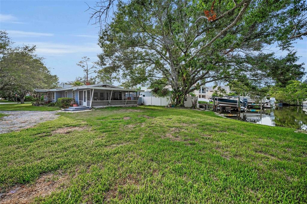 394 Georgia Avenue Crystal Beach, FL 34683 - Photo 25 of 69 a view of a house with a big yard