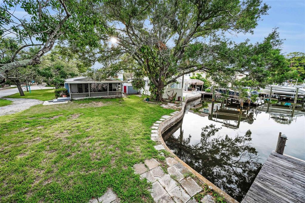394 Georgia Avenue Crystal Beach, FL 34683 - Photo 4 of 69 a view of a backyard with swimming pool