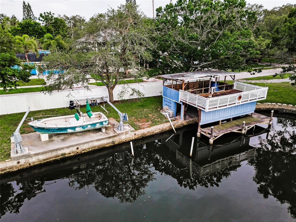 394 Georgia Avenue Crystal Beach, FL 34683 - Photo 41 of 69 an aerial view of a house with a garden and lake view
