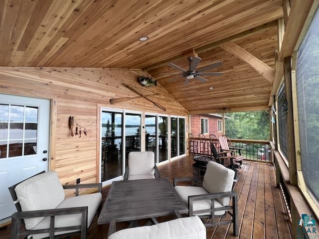 444 Fernberg Road, Unit 11 Ely, MN 55731 - Photo 13 of 19 Sunroom / solarium featuring outdoor lounge area and a ceiling fan