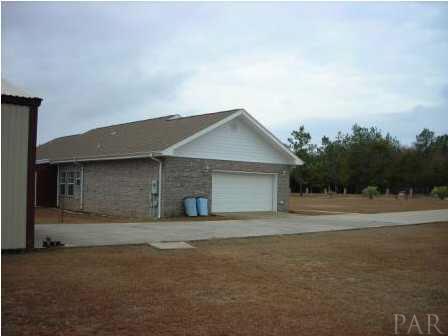 9491 American Farms Road Milton, FL 32583 - Photo 10 of 10 Side entry garage