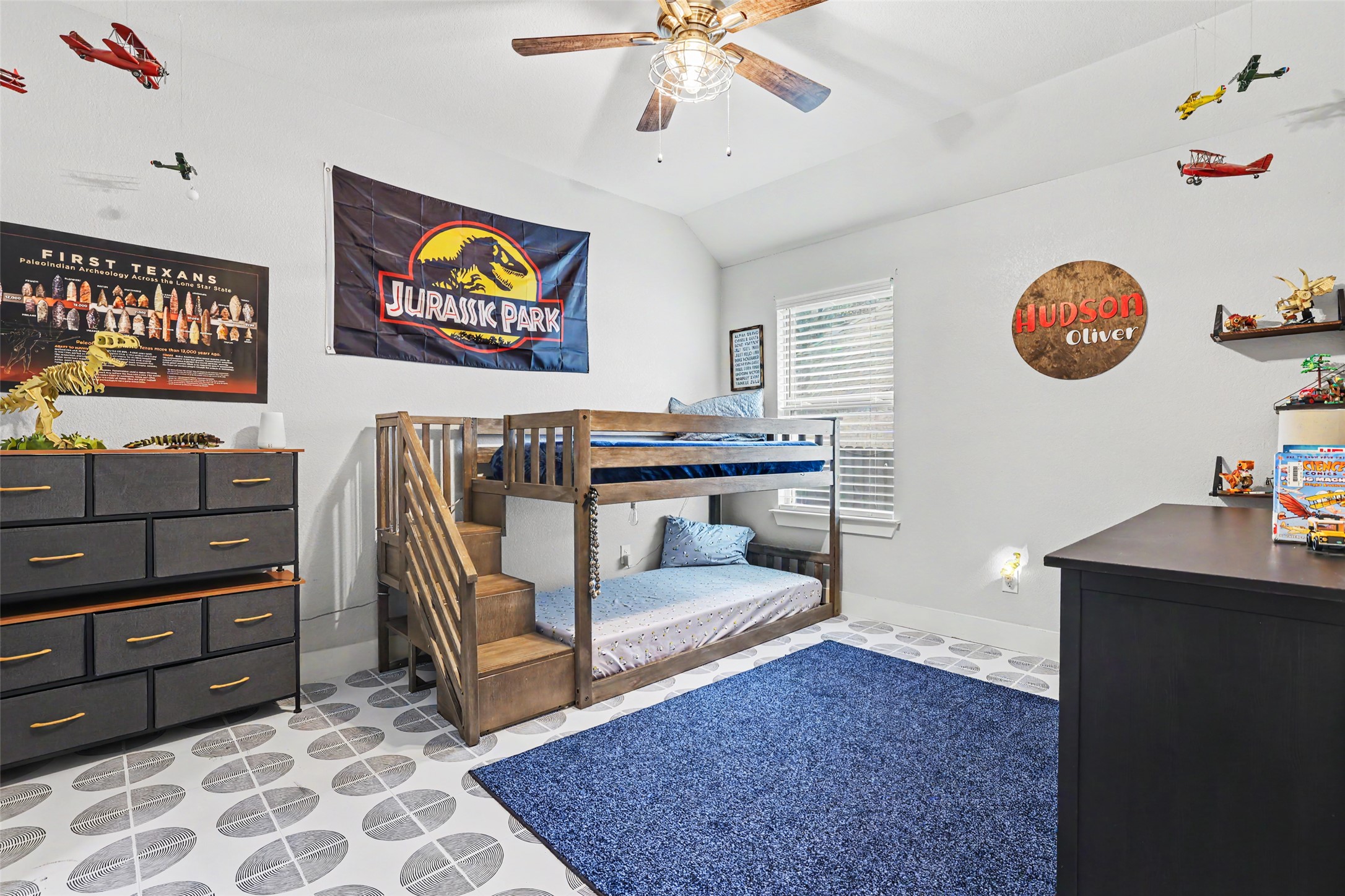 117 Rock Dock Road Georgetown, TX 78633 - Photo 29 of 38 a bedroom with a bed and paintings on the wall
