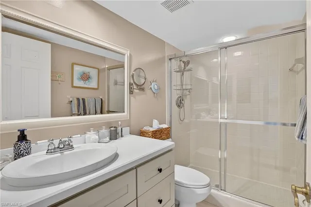a bathroom with a sink toilet tub and shower