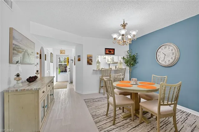 a dining room with furniture and a clock