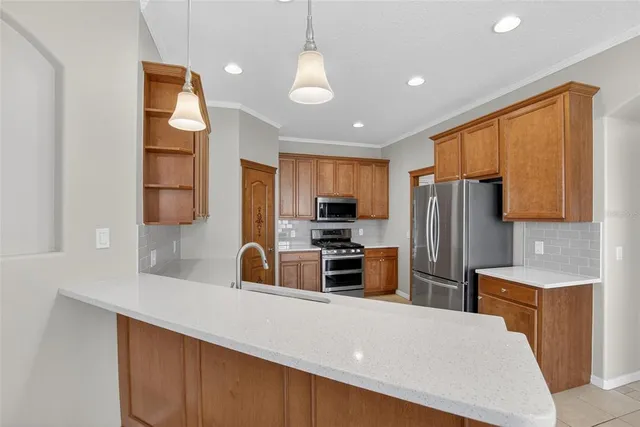 an empty room with ceiling fan and a window