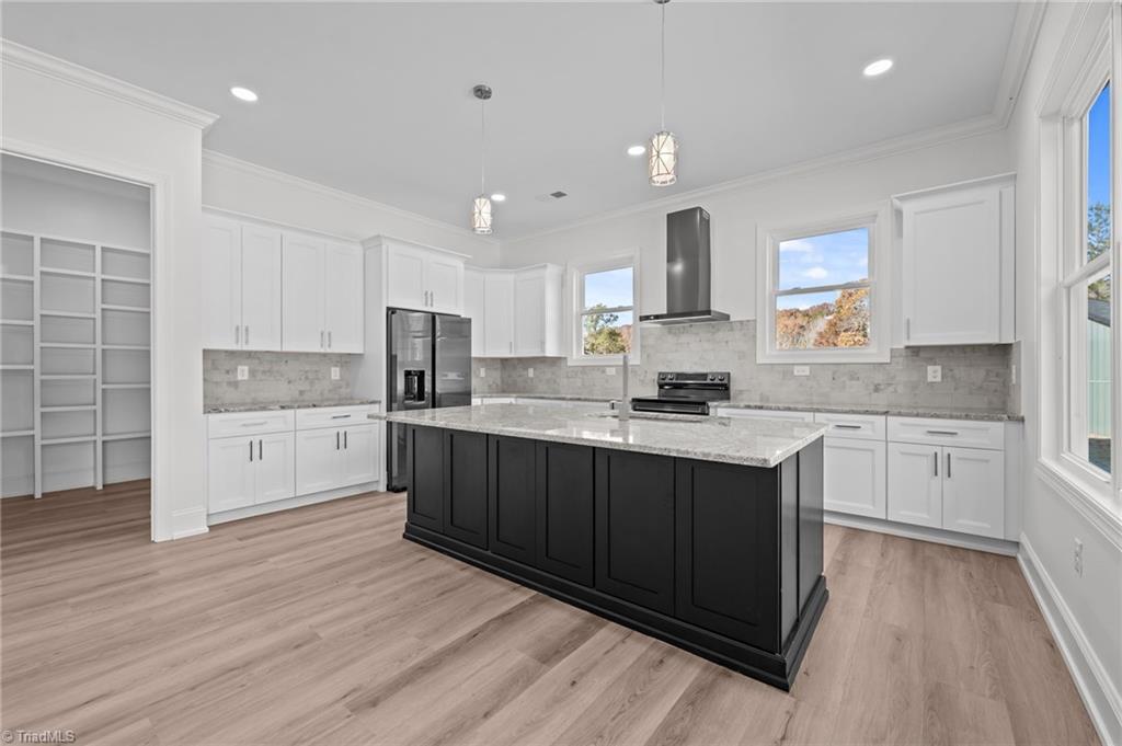 1168 Riverside Drive Lexington, NC 27292 - Photo 13 of 50 Don't miss out on the hardware builder installed under the island to easily open the doors underneath the cabinet.