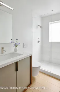 a bedroom with a bed and a chair