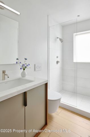 a bedroom with a bed and a chair