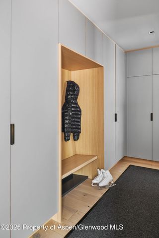 a view of a patio with table and chairs and floor to ceiling window