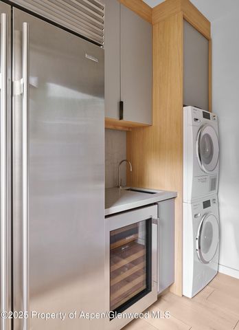 a view of a chair and tables in the balcony