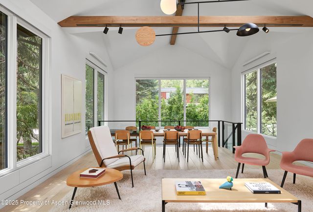 a outdoor space with patio the couches and a dining table with garden view
