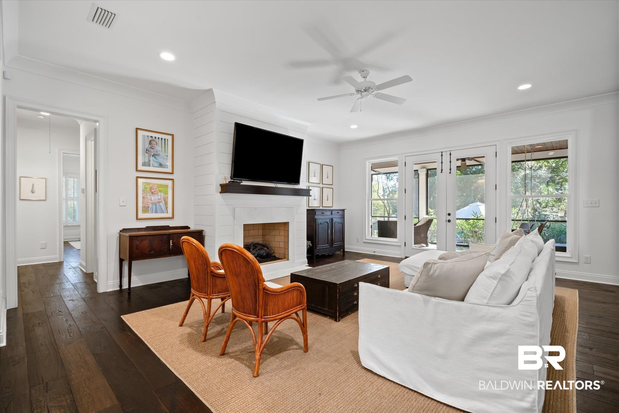 3713 Old Shell Road Mobile, AL 36608 - Photo 16 of 52 Living room with french doors, ornamental molding, ceiling fan, a fireplace, and dark hardwood / wood-style floors