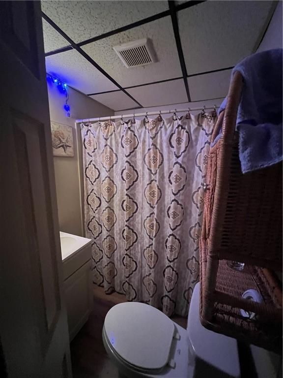 1619 Brownsville Road Pittsburgh, PA 15210 - Photo 12 of 33 a bathroom with a toilet and shower curtain