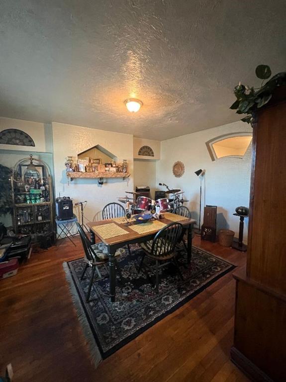 1619 Brownsville Road Pittsburgh, PA 15210 - Photo 13 of 33 a living room with furniture a rug and a fireplace