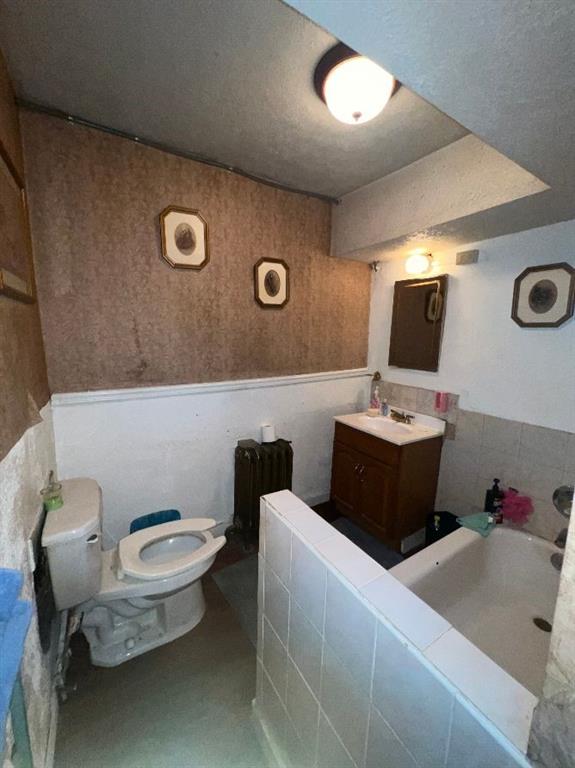 1619 Brownsville Road Pittsburgh, PA 15210 - Photo 17 of 33 a bathroom with a toilet sink and mirror