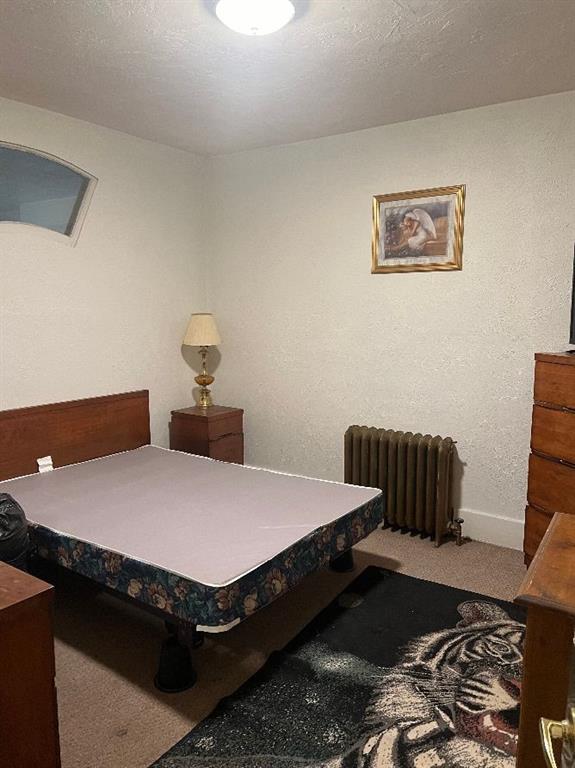 1619 Brownsville Road Pittsburgh, PA 15210 - Photo 18 of 33 a bedroom with bed table and chair