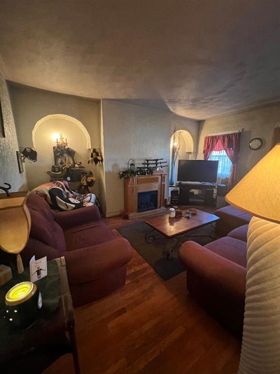 1619 Brownsville Road Pittsburgh, PA 15210 - Photo 19 of 33 a living room with furniture and a fireplace