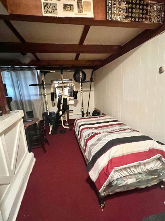 1619 Brownsville Road Pittsburgh, PA 15210 - Photo 25 of 33 a bed sitting in a bedroom next to a window
