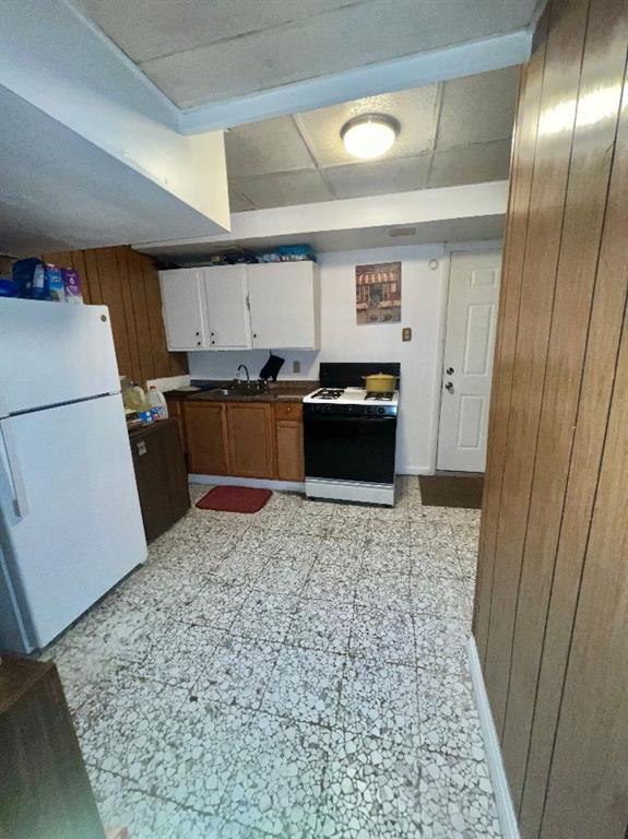 1619 Brownsville Road Pittsburgh, PA 15210 - Photo 26 of 33 a kitchen with granite countertop stainless steel appliances a refrigerator a stove top oven a sink and dishwasher