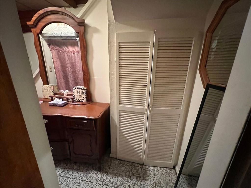 1619 Brownsville Road Pittsburgh, PA 15210 - Photo 29 of 33 a bathroom with a sink a toilet and mirror