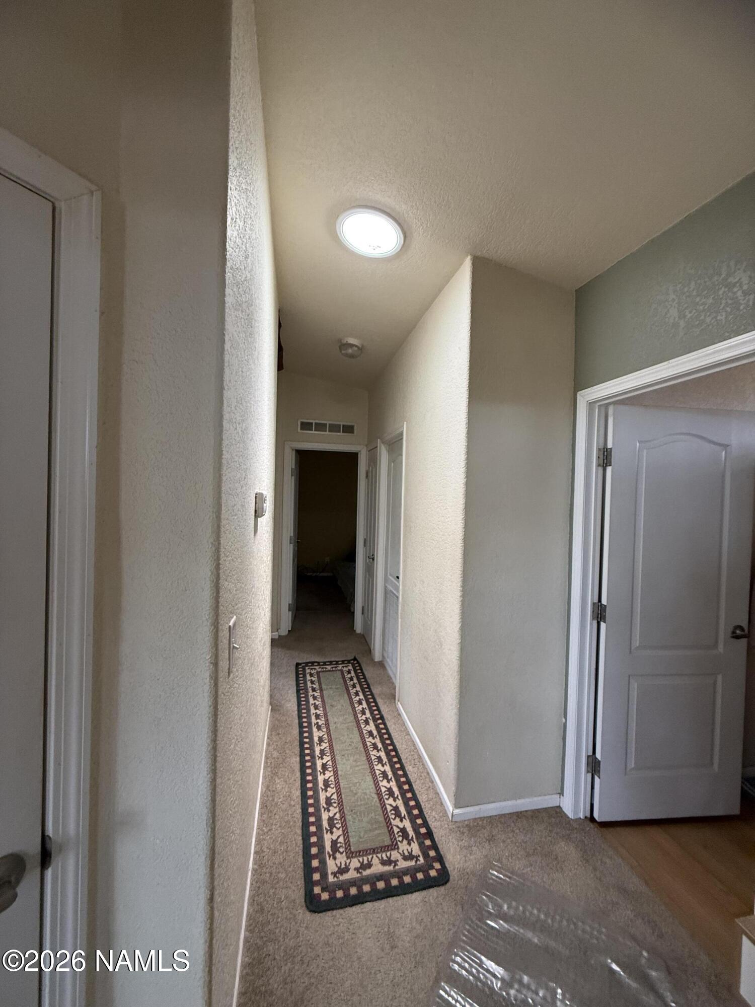 1431 East Cedar Road Williams, AZ 86046 - Photo 23 of 51 a view of room with window and a hallway