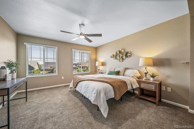 a bed room with a bed and a window