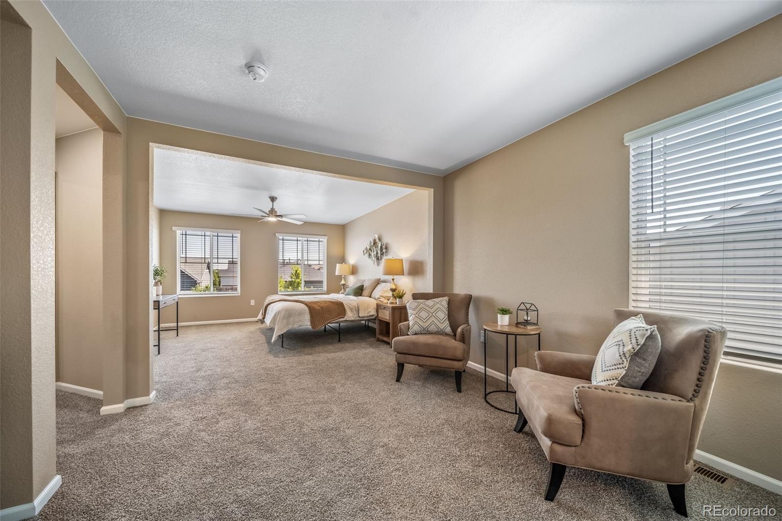 1 South Quantock Street Aurora, CO 80018 - Photo 13 of 43 a living room with furniture and a large window