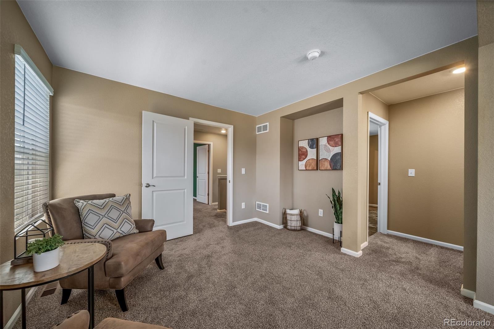 1 South Quantock Street Aurora, CO 80018 - Photo 14 of 43 a living room with furniture and a area