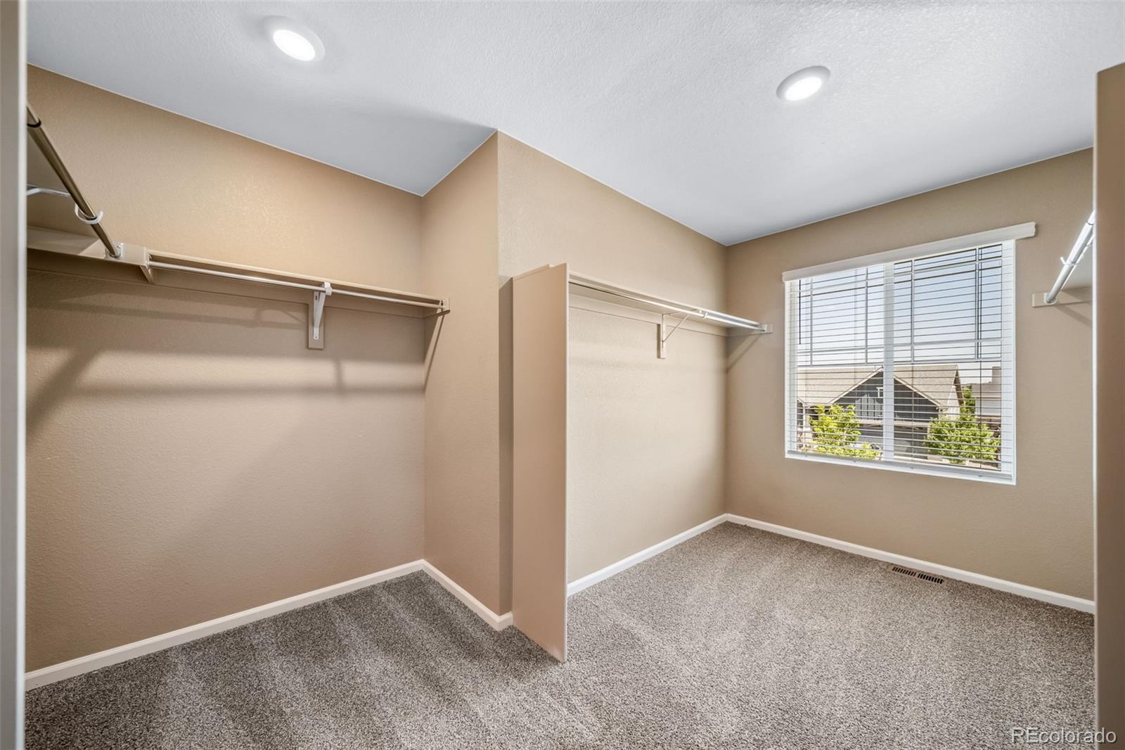 1 South Quantock Street Aurora, CO 80018 - Photo 17 of 43 an empty room with windows and closet