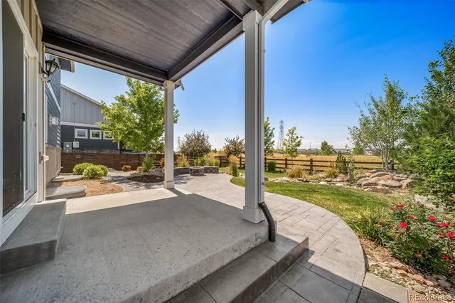 a view of a backyard with sitting area