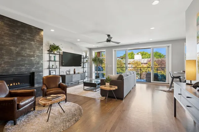 a living room with furniture fireplace and a flat screen tv