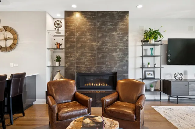 a living room with furniture and a fireplace