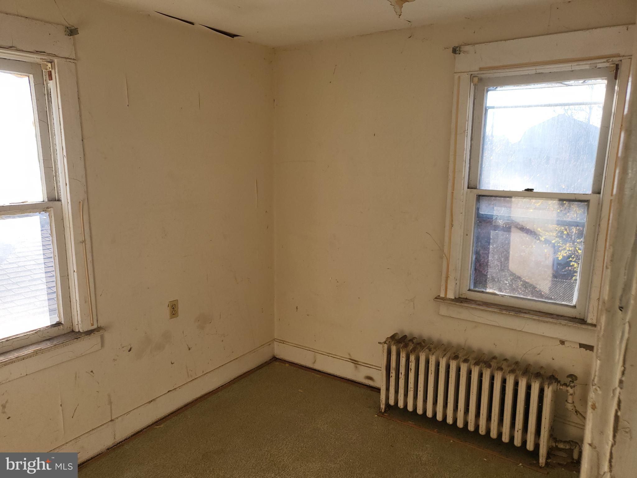 57 New Cedar Lane Hamilton, NJ 08610 - Photo 3 of 9 an empty room with windows