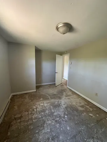 an empty room with a empty space and a window