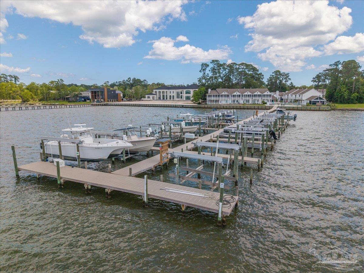 26063 Canal Road, Unit 3F Orange Beach, AL 36561 - Photo 2 of 72 a view of a lake with outdoor seating and city view