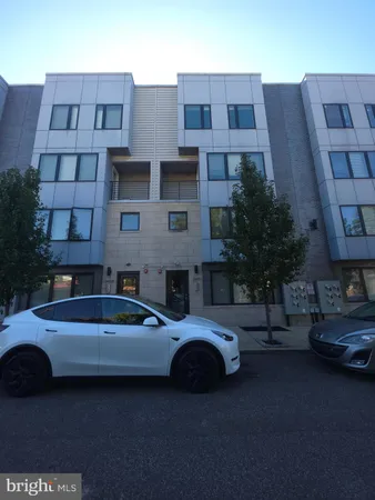 a view of a car parked in front of a building