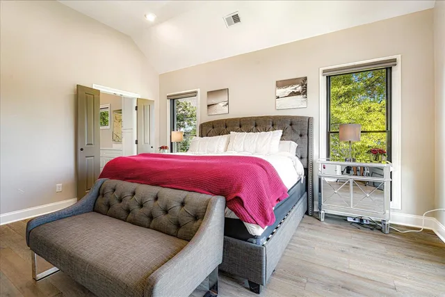 a bedroom with a bed and window