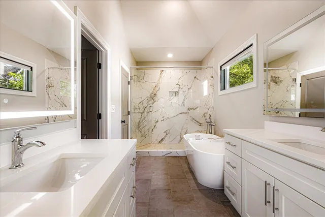 a spacious bathroom with a toilet sink and mirror