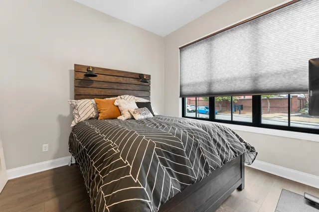 a bedroom with a bed and window