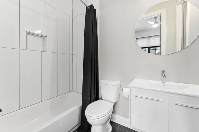 a bathroom with a sink toilet and vanity