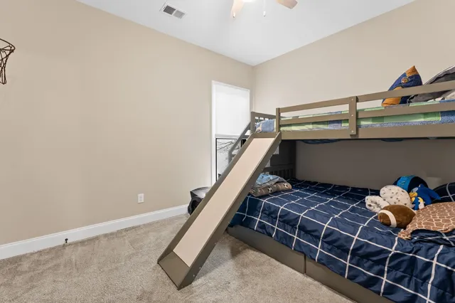 a room with water heater and stairs