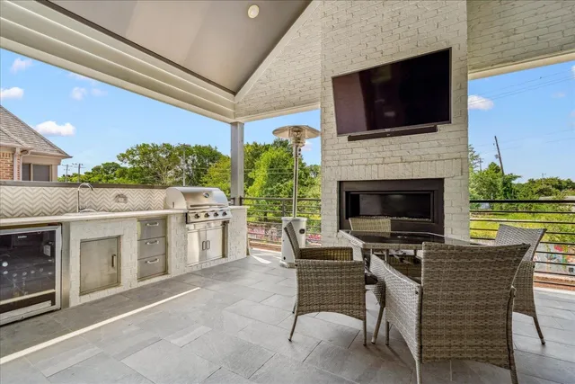 a view of a patio with a table and chairs