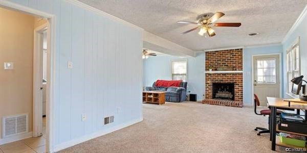 517 Wallingham Drive Midlothian, VA 23114 - Photo 3 of 11 a view of a livingroom with furniture and a fireplace