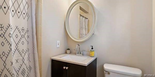 517 Wallingham Drive Midlothian, VA 23114 - Photo 10 of 11 a bathroom with a sink and a mirror