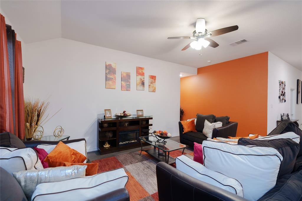 4009 Forest Bend Road Denton, TX 76208 - Photo 11 of 35 Living room with a ceiling fan, wood finished floors, and lofted ceiling