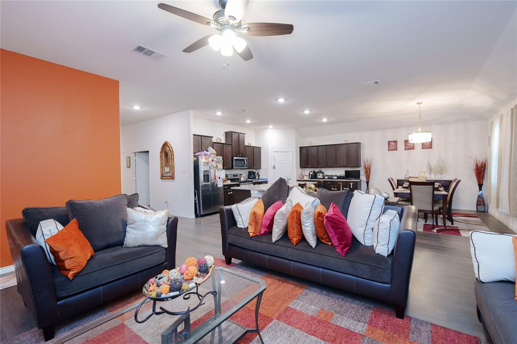 4009 Forest Bend Road Denton, TX 76208 - Photo 13 of 35 Living room featuring a ceiling fan, wood finished floors, and recessed lighting