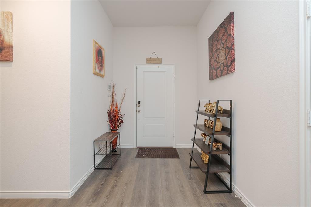 4009 Forest Bend Road Denton, TX 76208 - Photo 15 of 35 Foyer entrance with wood finished floors and baseboards