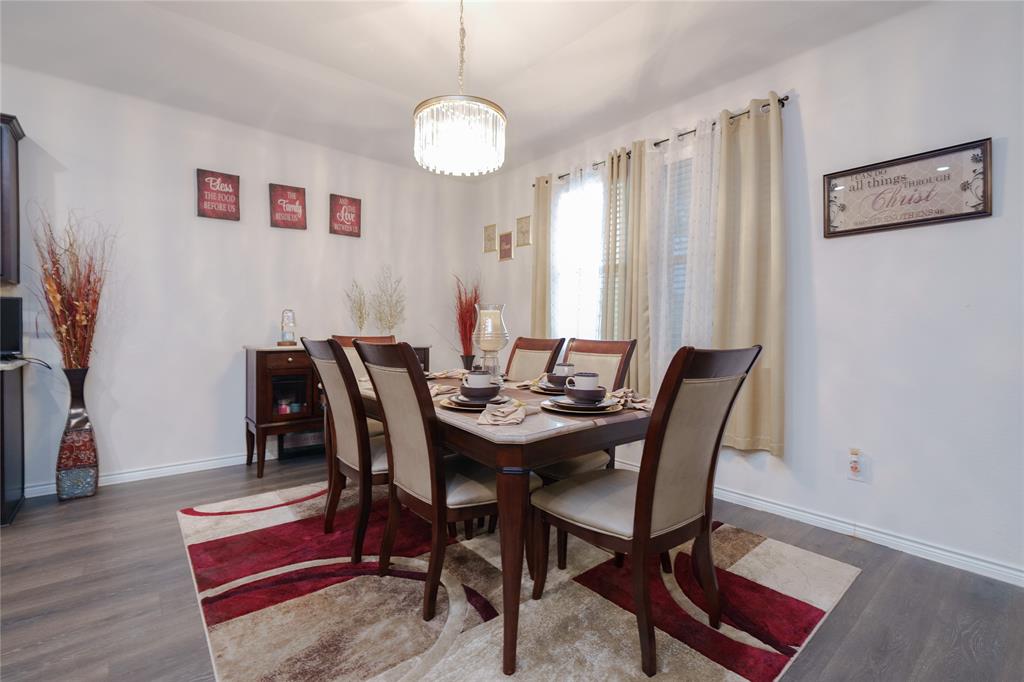 4009 Forest Bend Road Denton, TX 76208 - Photo 17 of 35 Dining room with dark wood-style flooring and suspended lighting
